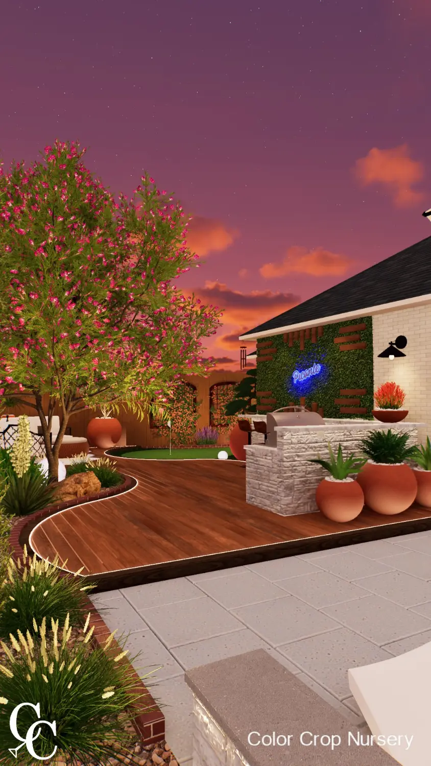 Luxury backyard transformation with wooden deck, flowering crepe myrtle tree, and modern outdoor entertainment area at sunset